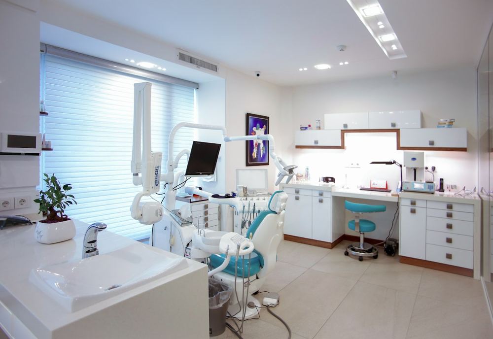 Modern dental surgery with treatment chair and equipment